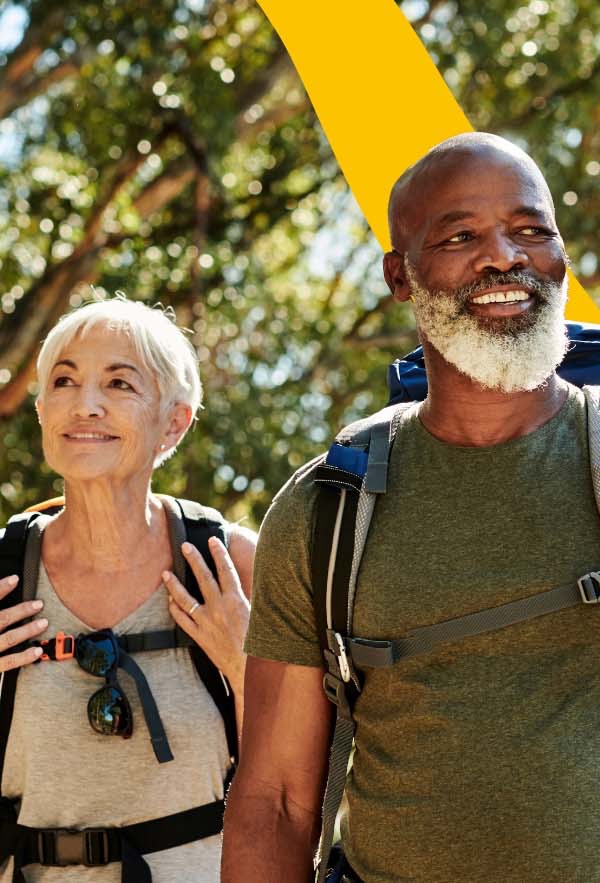 lady and man with backpacks hiking outdoors